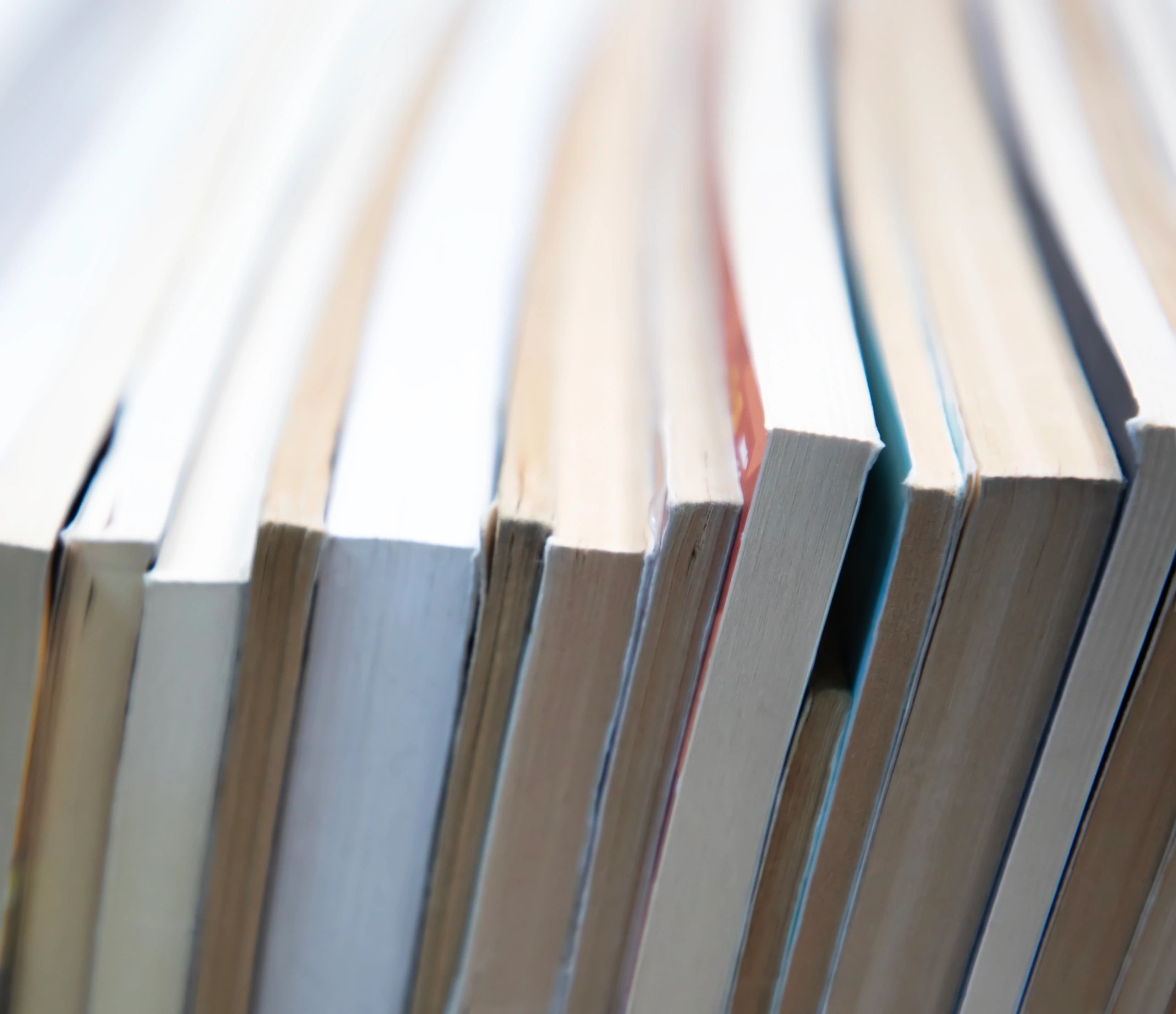 Stack of books representing study, research, and formation